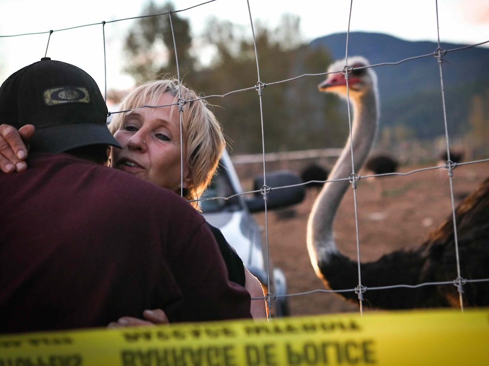 Karen Espersen, the co-owner of Universal Ostrich Farms, embraces a supporter at the farm in Edgewood, B.C., on Monday, Sept. 22, 2025, as the Canadian Food Agency prepares to cull 400 of the farm’s ostriches this week. THE CANADIAN PRESS/Aaron Hemens